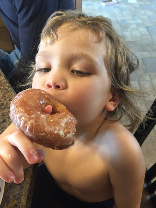 Karyn's daughter enjoying donut