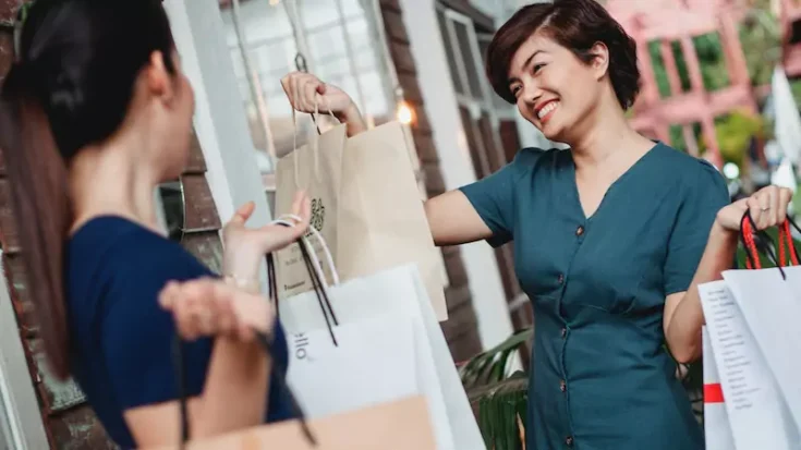 Women carrying paper bags